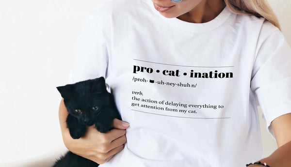 girl holding black cat wearing text tshirt